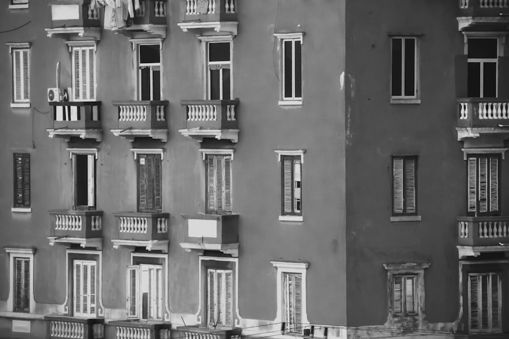 a black and white photo of a building with many windows