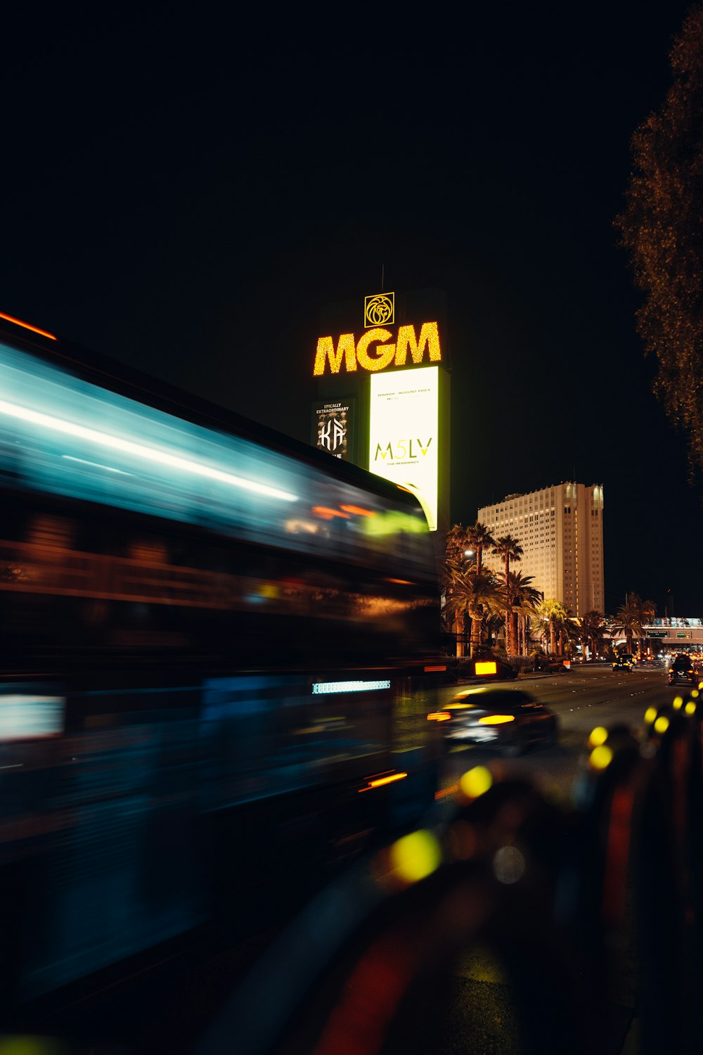 a blurry photo of a city street at night