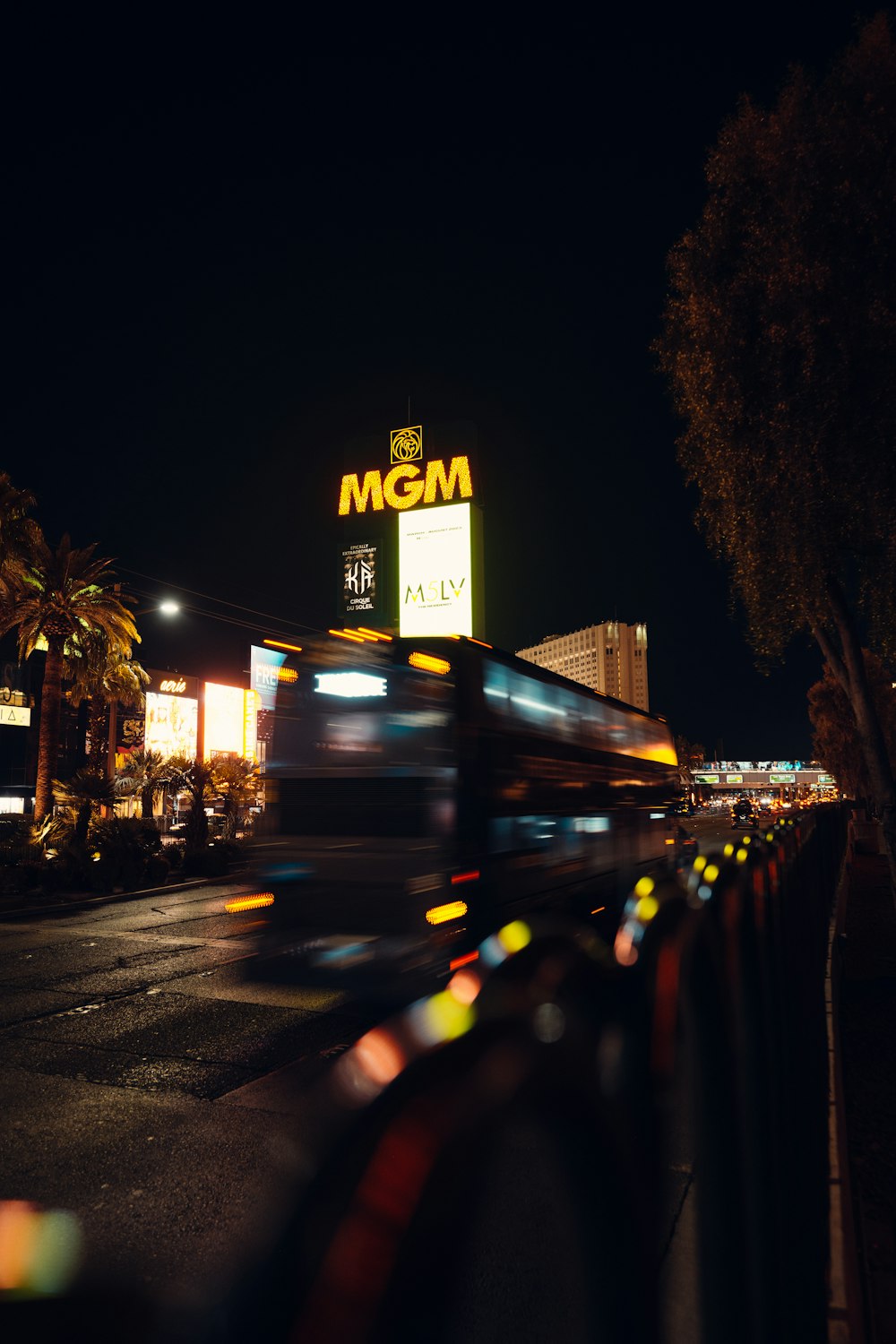 a blurry photo of a bus driving down the street