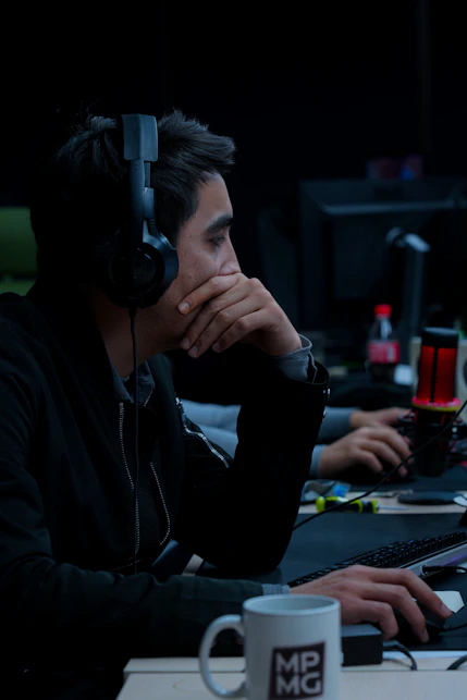 Person deeply focused in front of a monitor, embodying mental flow and calm