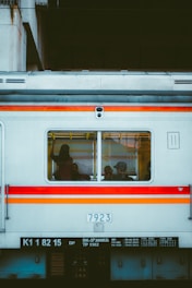 a train car with people sitting inside of it