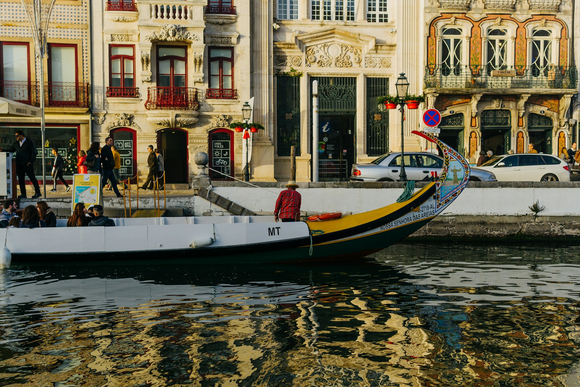 a boat with people on it in a body of water