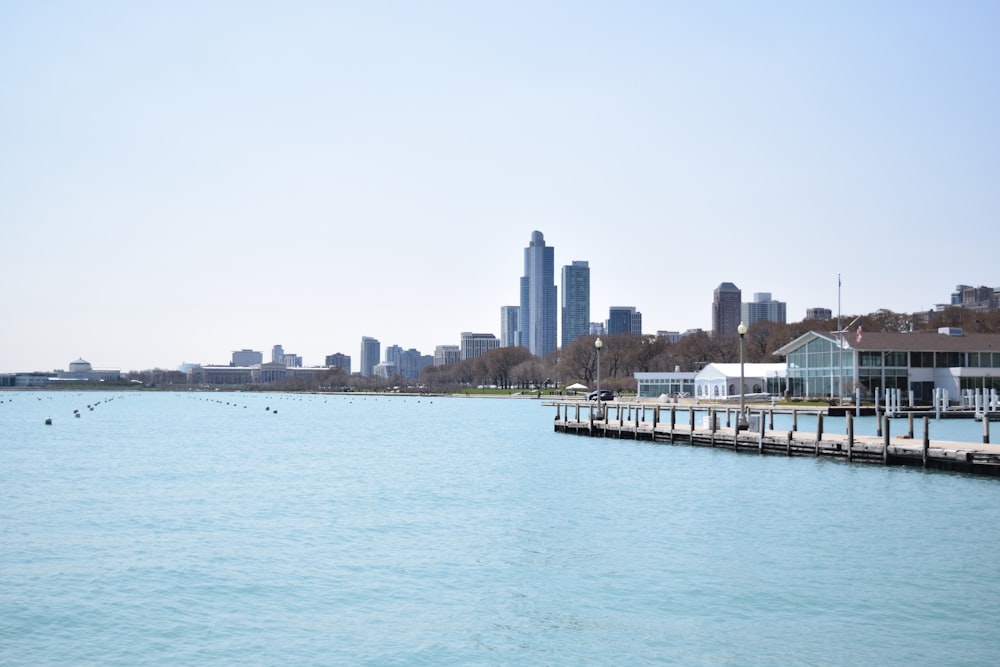 a large body of water with a city in the background