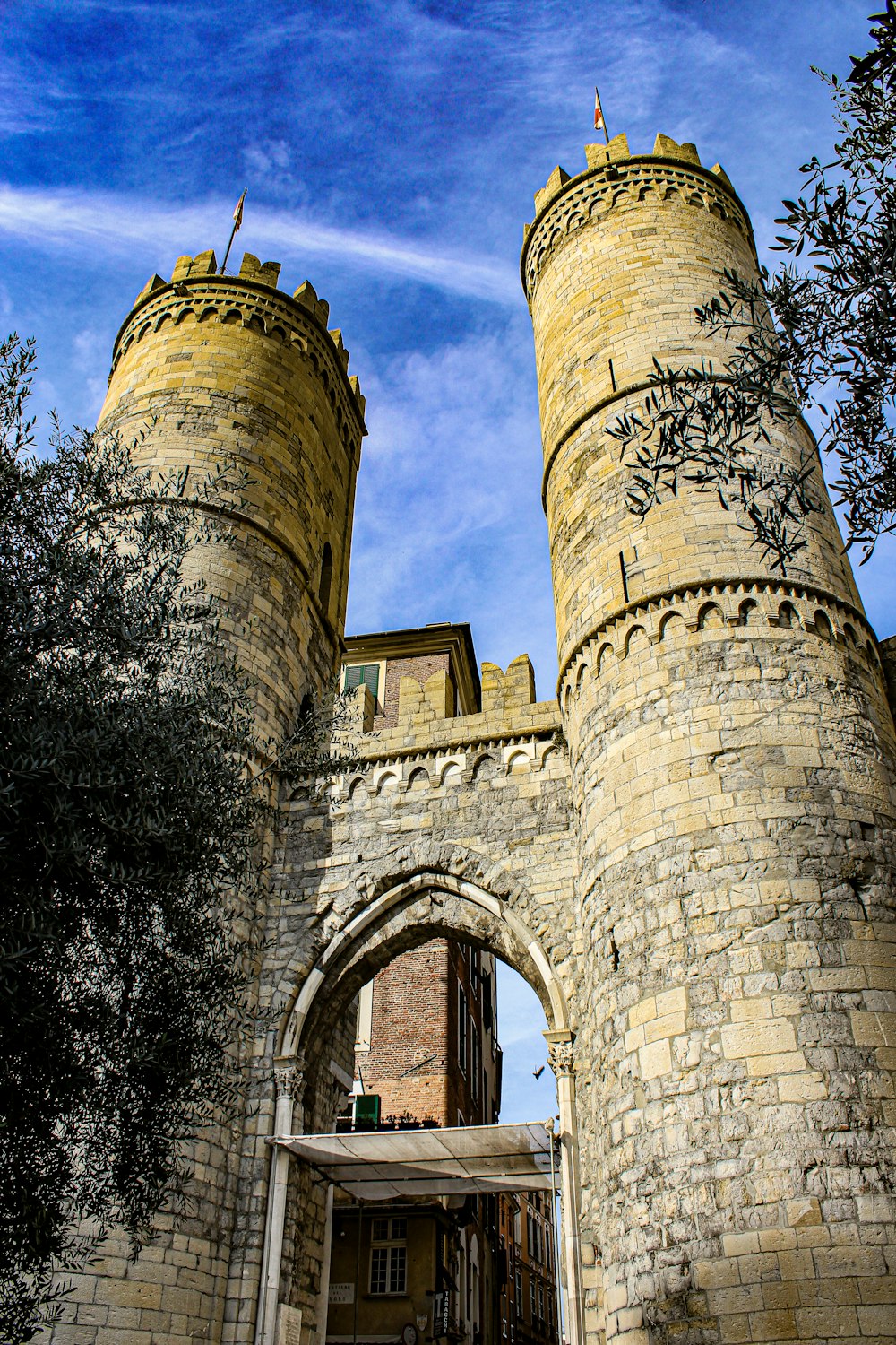 a castle gate with a clock on the top of it