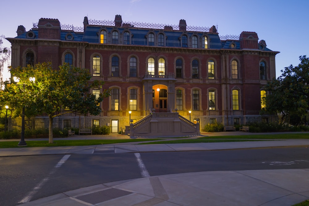 a large building with a lot of windows at night