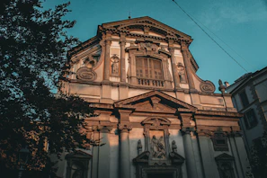 High-resolution photo of an old colonial church facade in Minas Gerais under soft morning light.