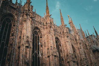 The striking façade of Orvieto Cathedral with its intricate mosaics and gothic spires.
