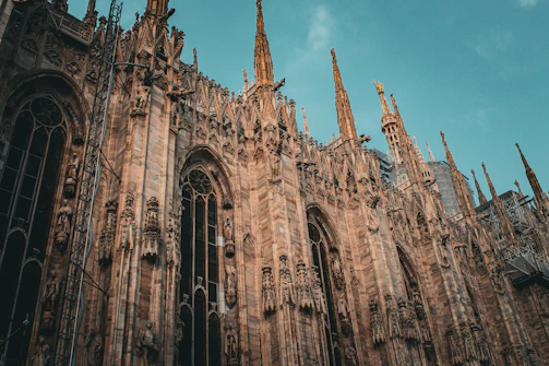 The striking façade of Orvieto Cathedral with its intricate mosaics and gothic spires.