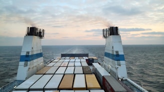 a large cargo ship in the middle of the ocean