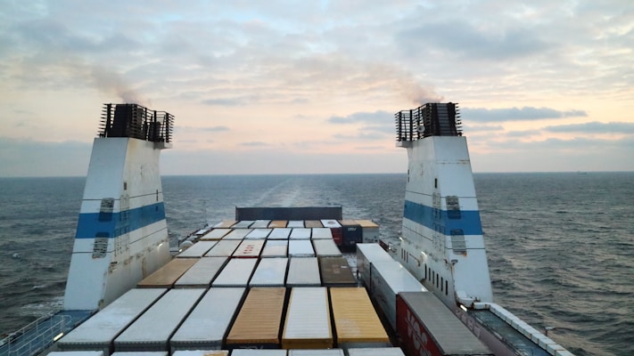 a large cargo ship in the middle of the ocean