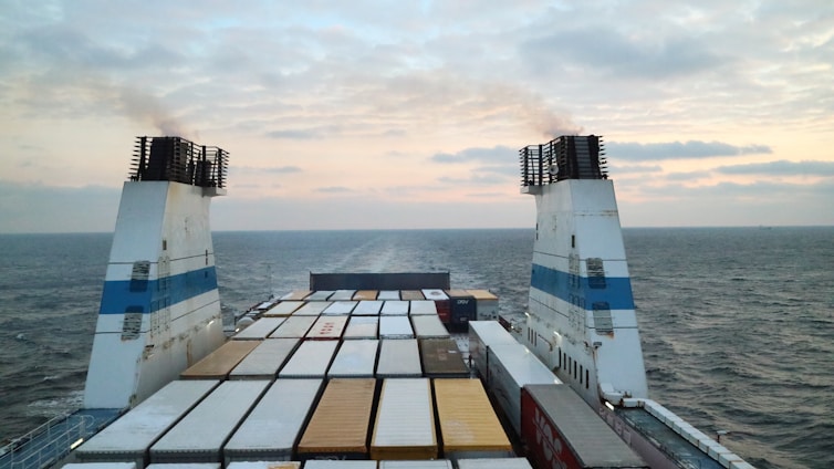 a large cargo ship in the middle of the ocean