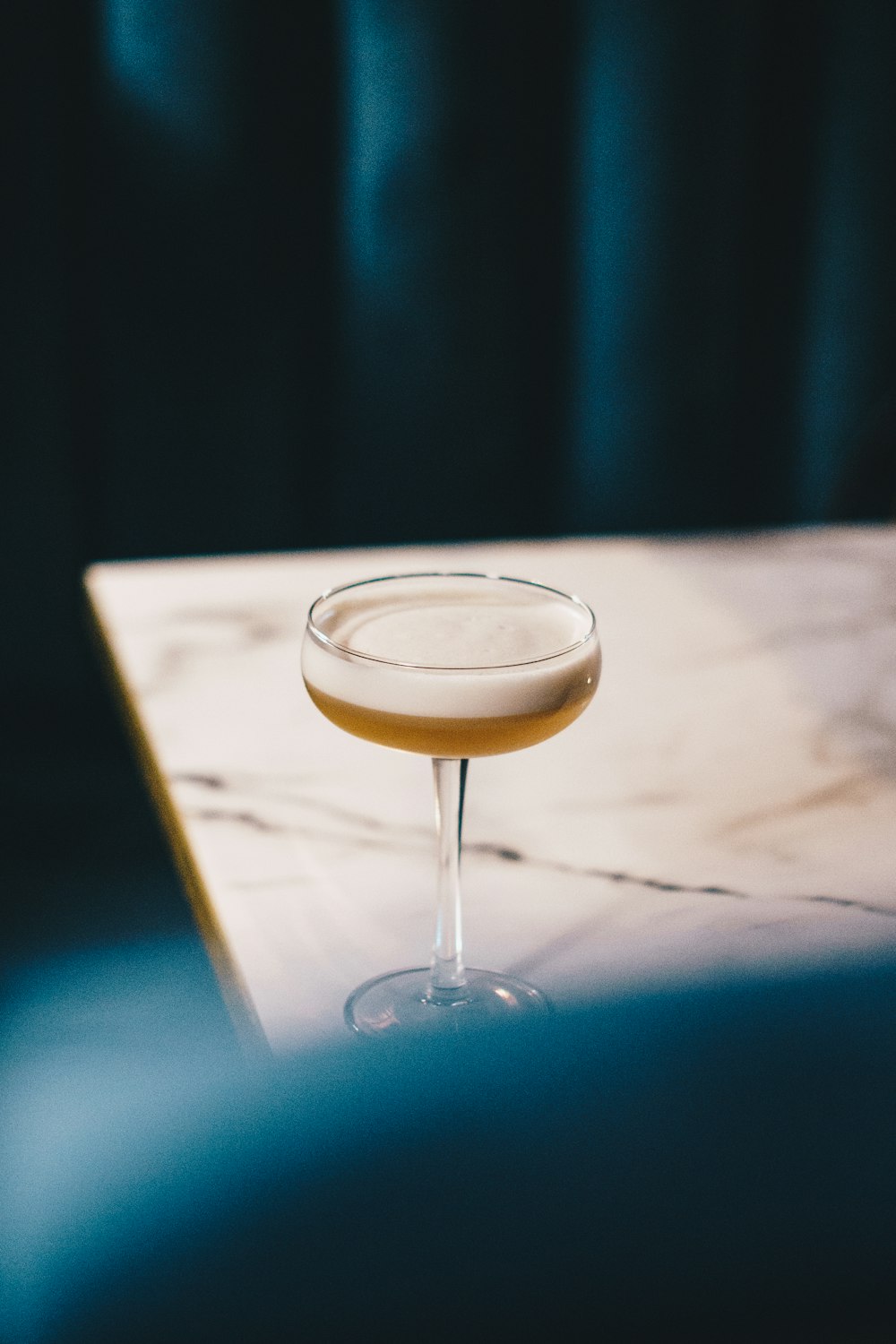 a close up of a wine glass on a table