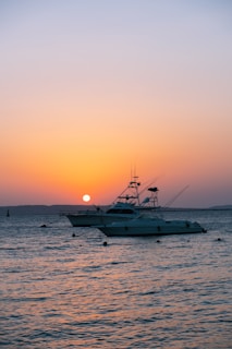 a boat floating on top of a body of water