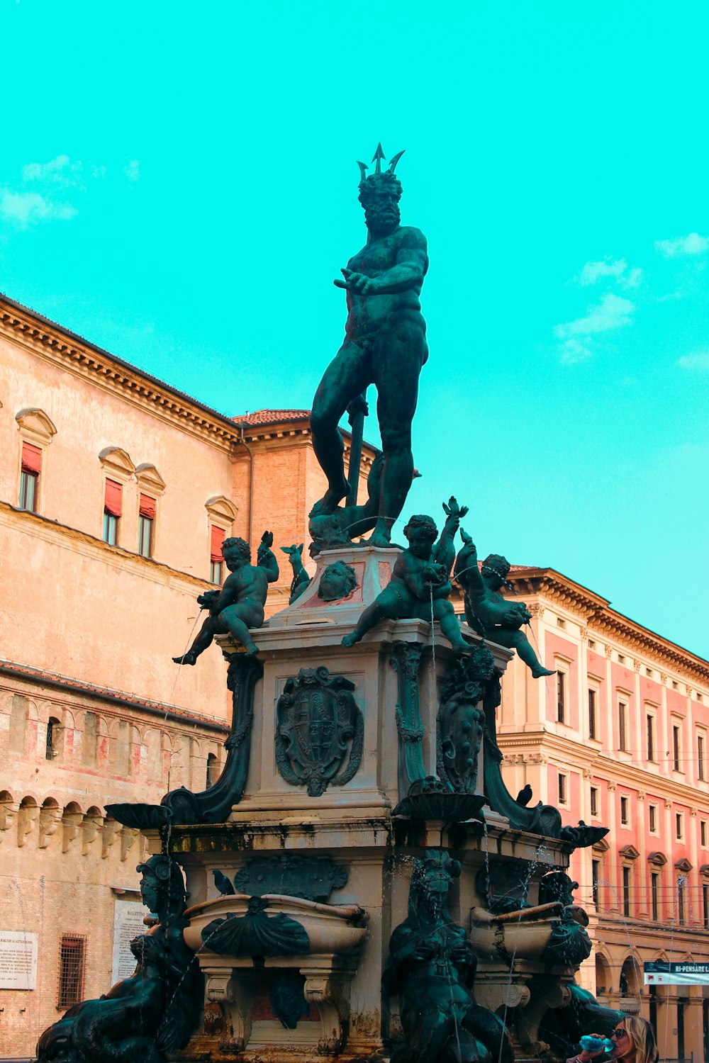 a statue of a man with a crown on top of it