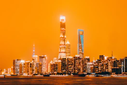 A vibrant city skyline at dawn representing global transformation and hope.