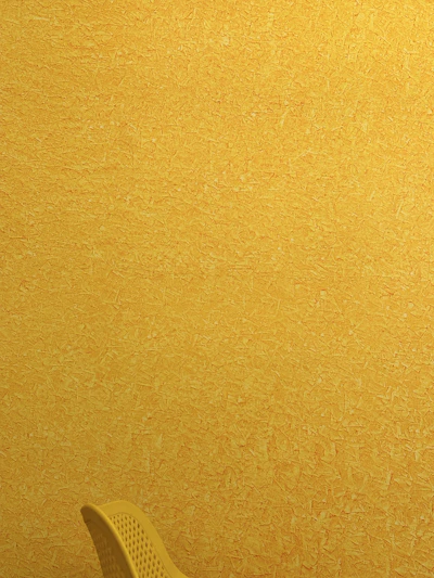 A vibrant living room wall freshly painted in bright yellow with smooth, even finish.