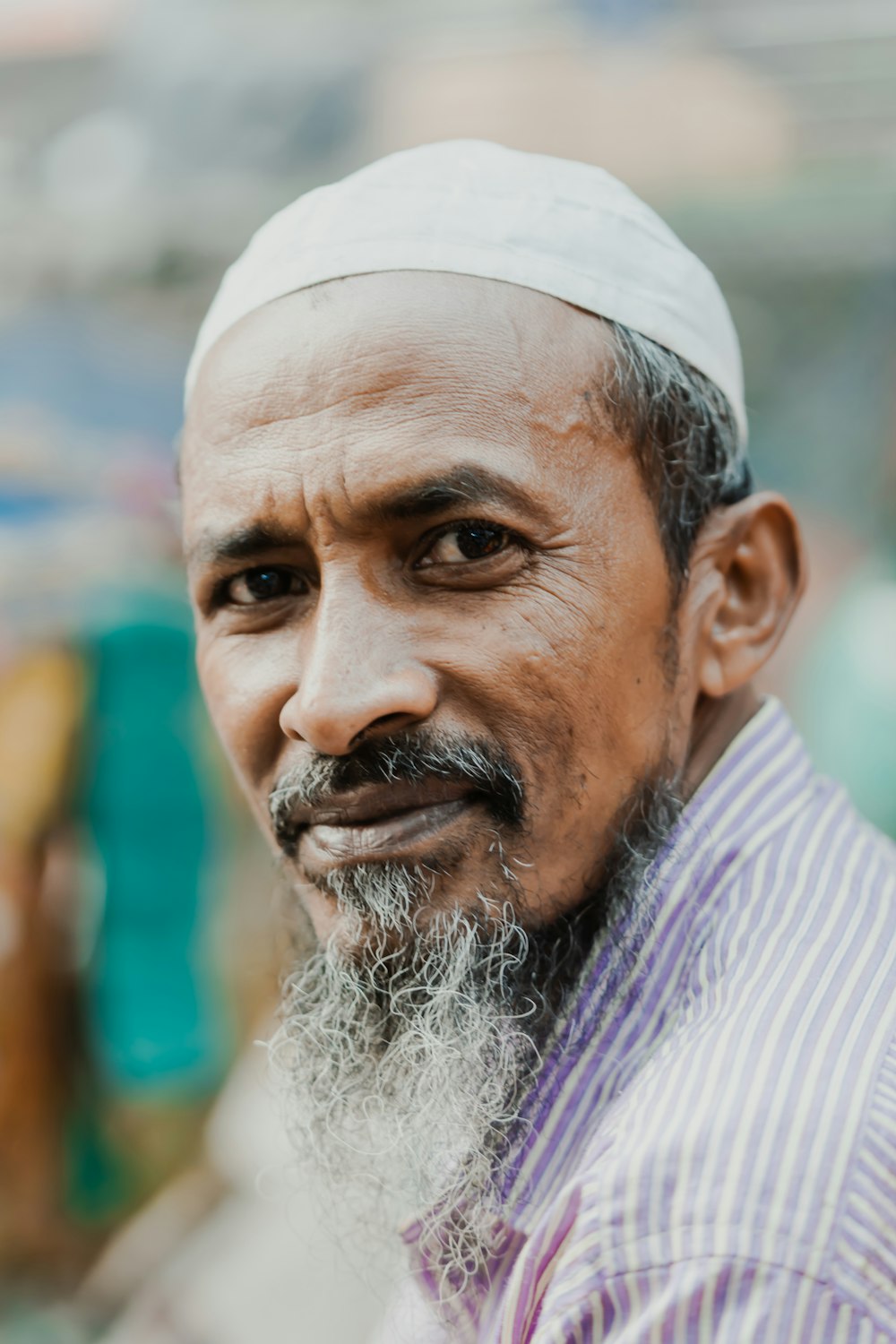 a man with a white beard and a striped shirt