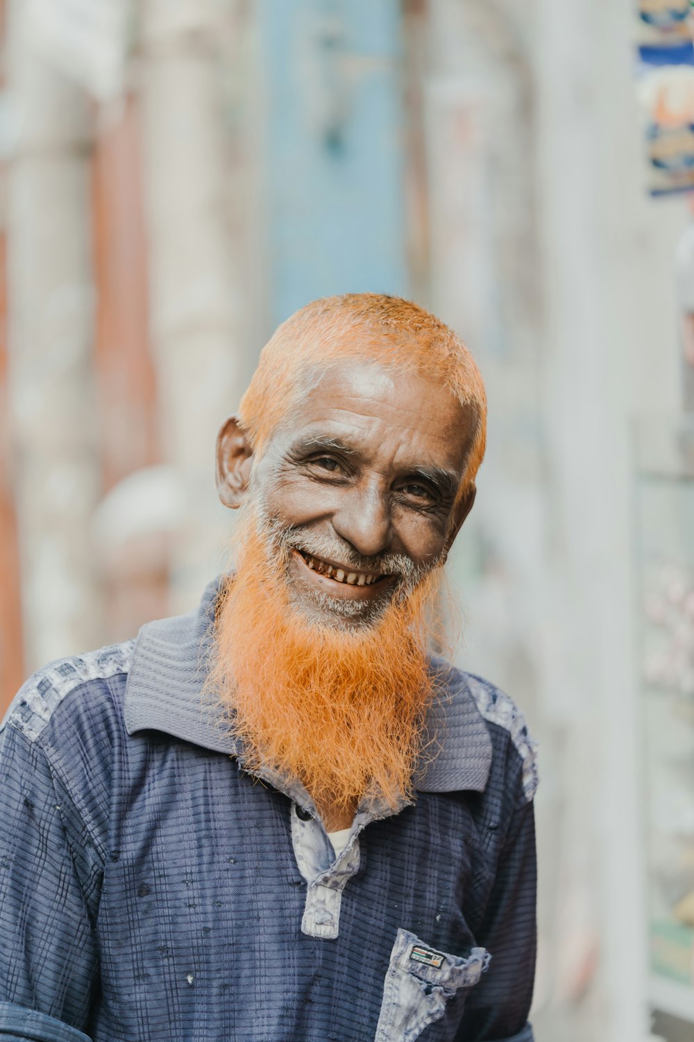 a man with a red beard and a blue shirt