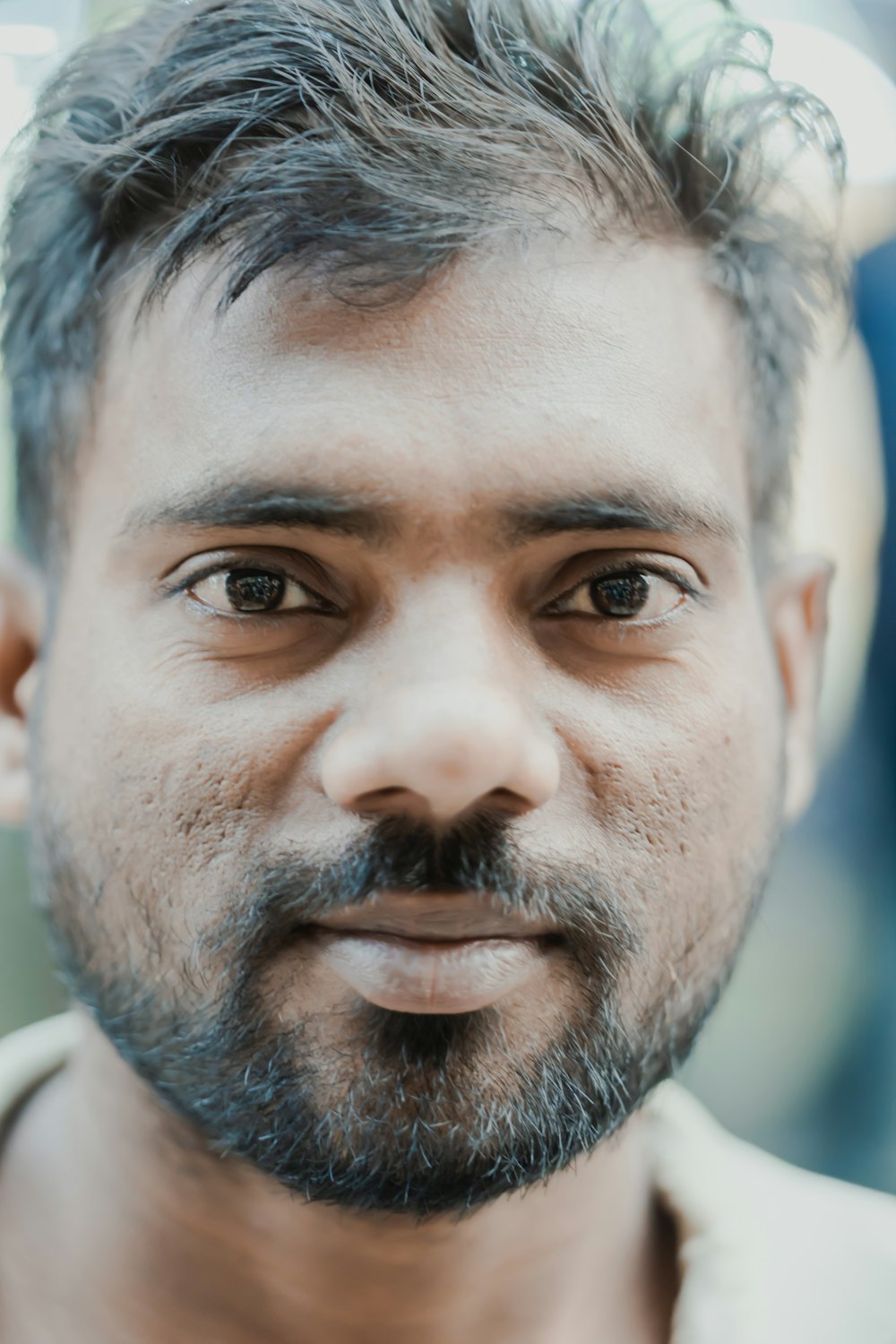 a close up of a person with a beard