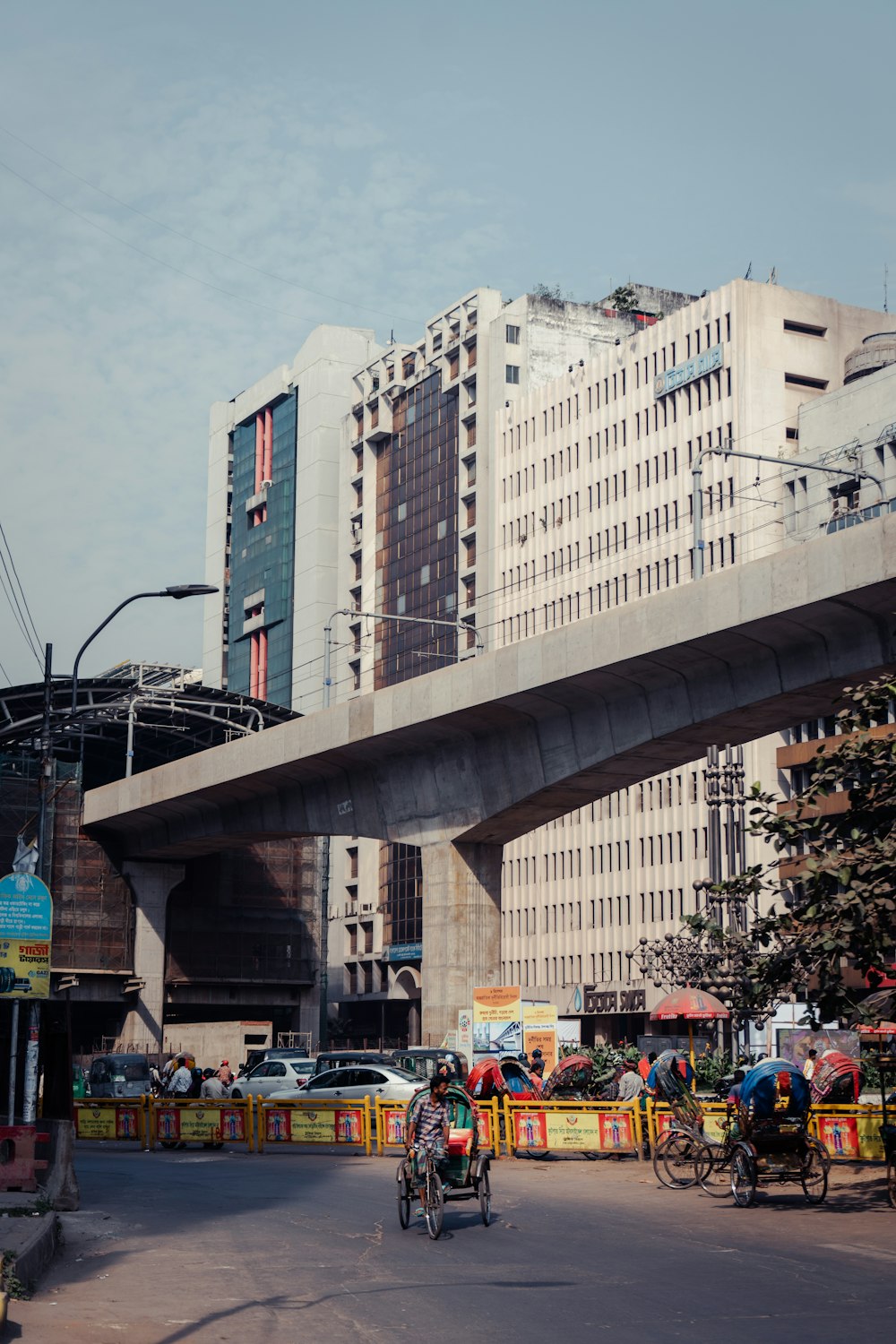 a city street with a bridge over it