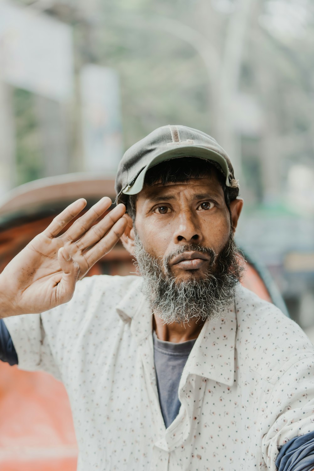 a man with a beard and a hat on