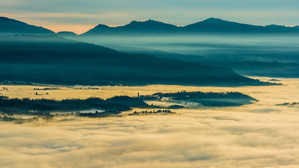 a view of a mountain range from above the clouds