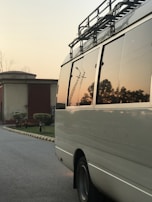 An Express Garage Co. van parked outside a residential home during a sunset service.