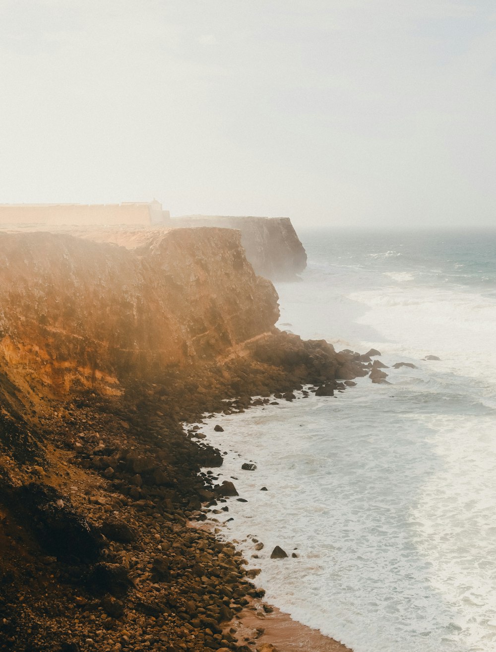 a view of the ocean from the top of a cliff