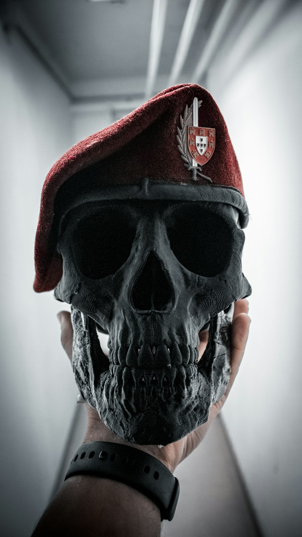 a skull wearing a red beret and a red beret hat