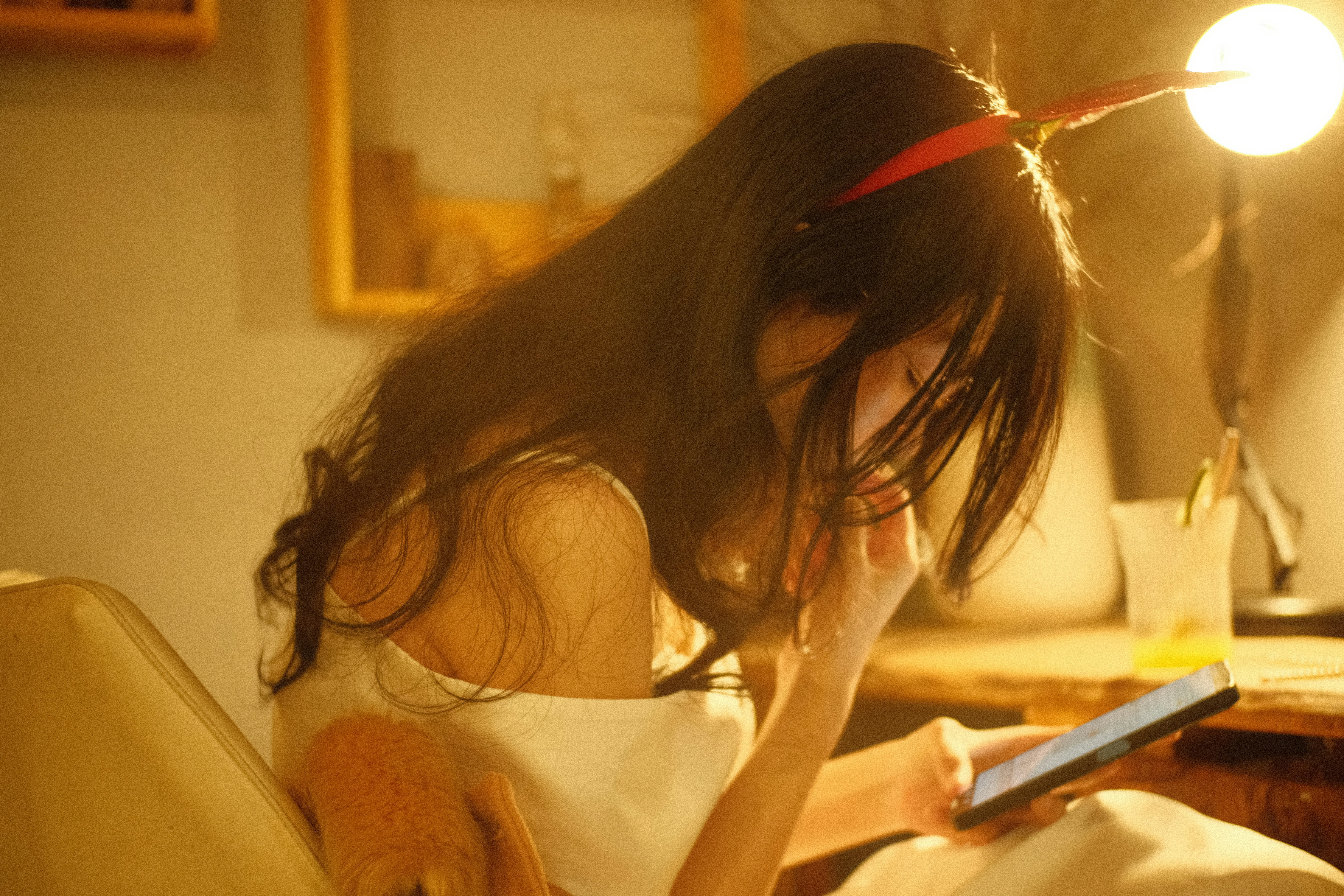 Happy woman reading an e-book on tablet in a bright room