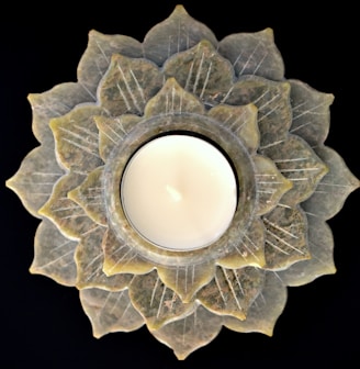 a candle that is sitting on a plate