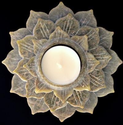 a candle that is sitting on a plate