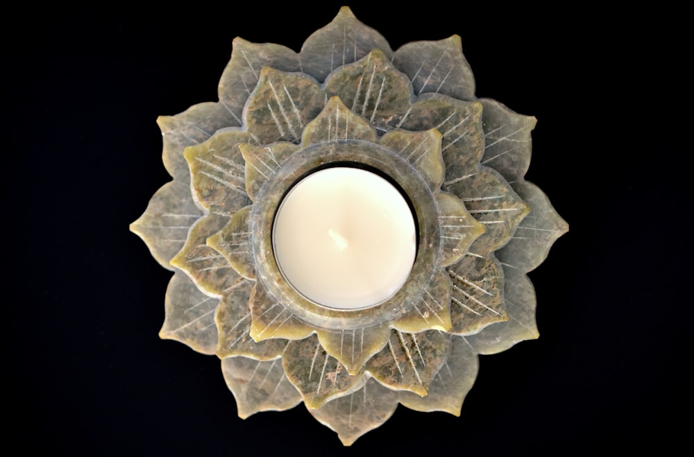 a candle that is sitting on a plate