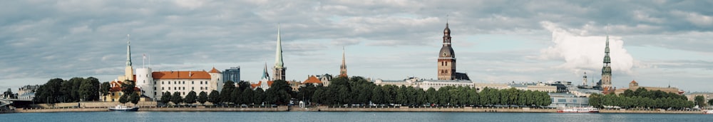 a large body of water with a city in the background