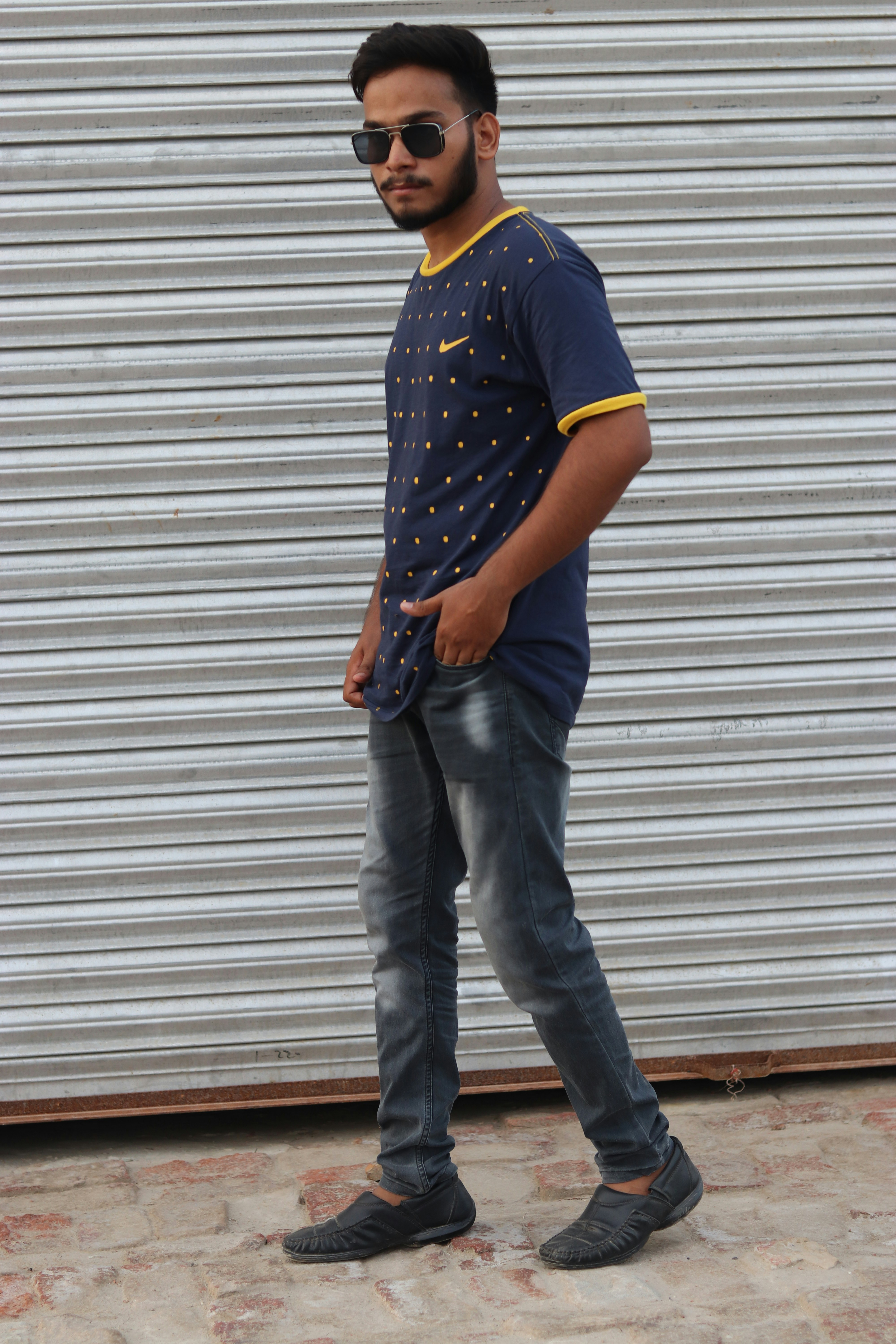 a man standing in front of a garage door