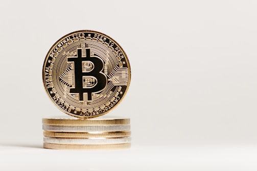 A close-up shot of Bitcoin coins stacked together.