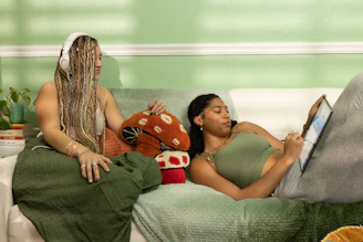 A counselor listening attentively to a teenager in a cozy room.