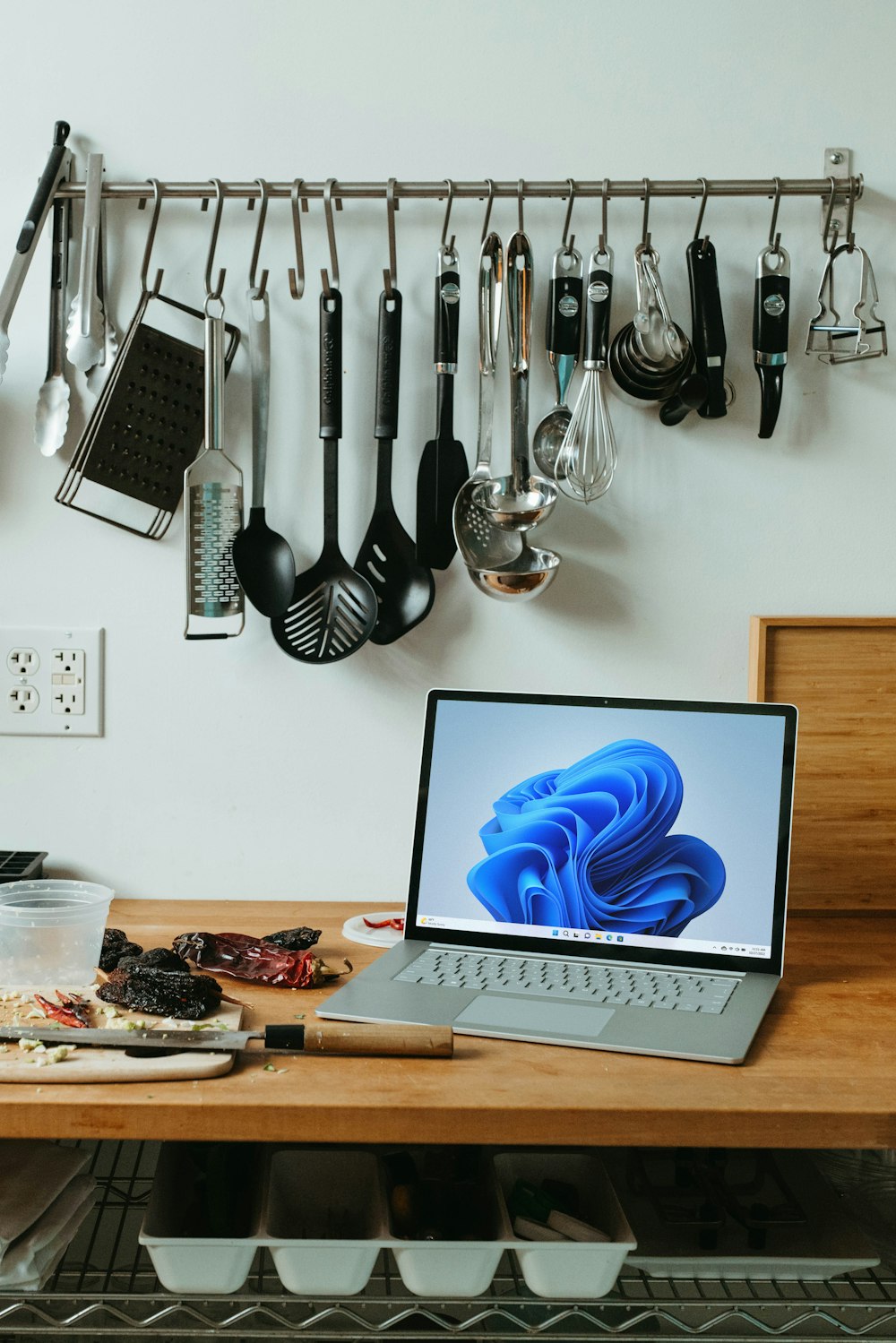 a laptop computer sitting on top of a wooden table