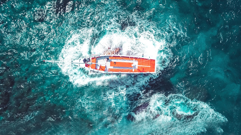 a small boat in the middle of the ocean