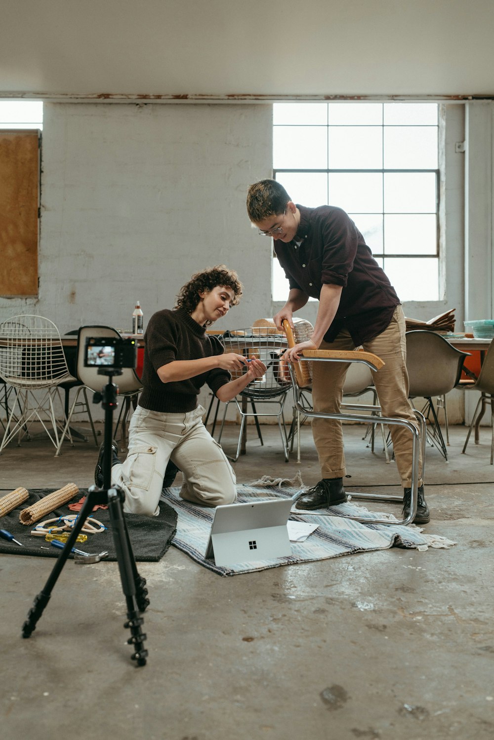 a man and a woman working on a project