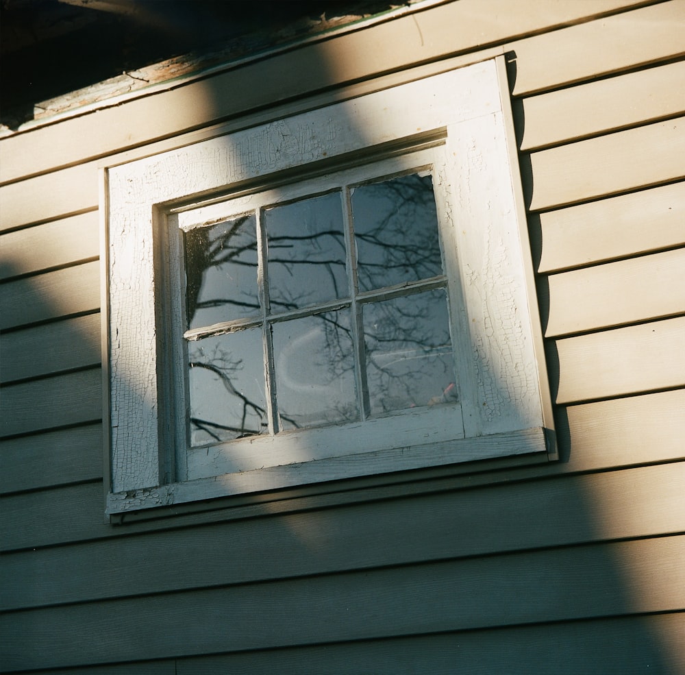 a window on the side of a house