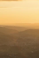 Sunset over the hills of Santa Catarina with warm golden light bathing the landscape.