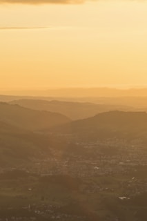 Sunset over the rolling hills surrounding Paperino, casting warm golden light