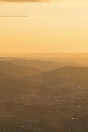 Sunset casting warm golden light over the rolling hills of Rancho El Rosario.