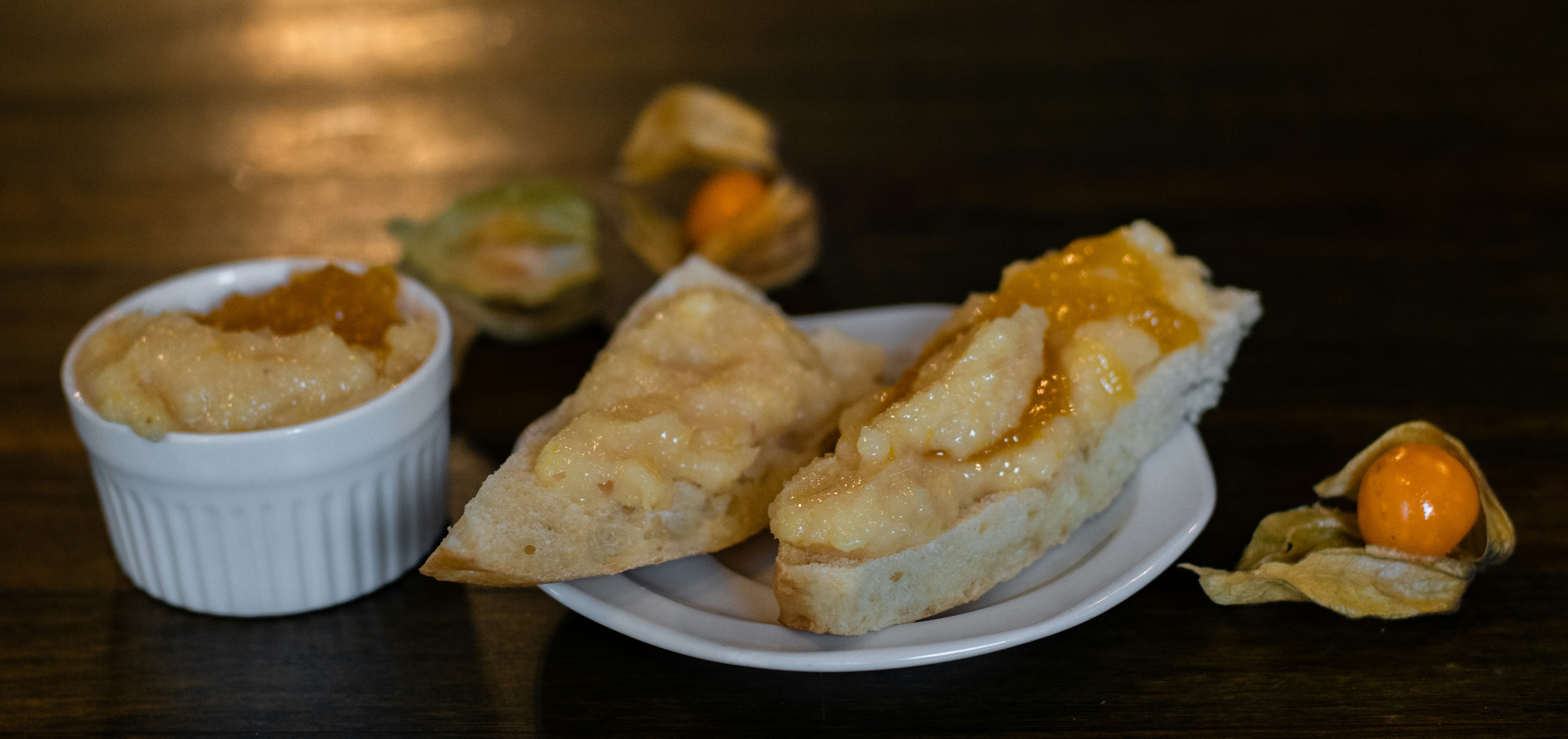 a white plate topped with two pieces of food