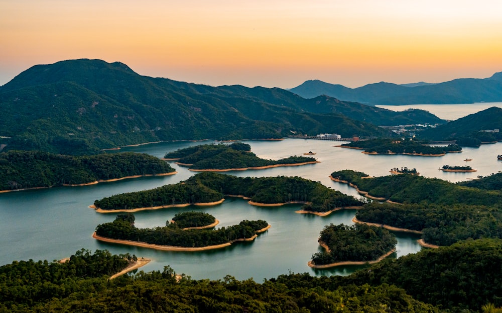 an aerial view of a lake surrounded by mountains