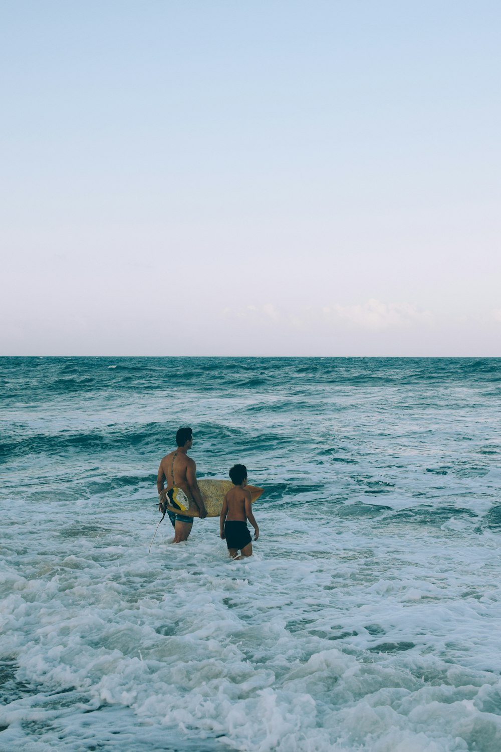 a couple of people that are in the water