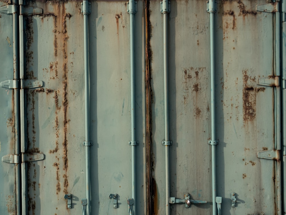 a close up of a metal container with rust on it