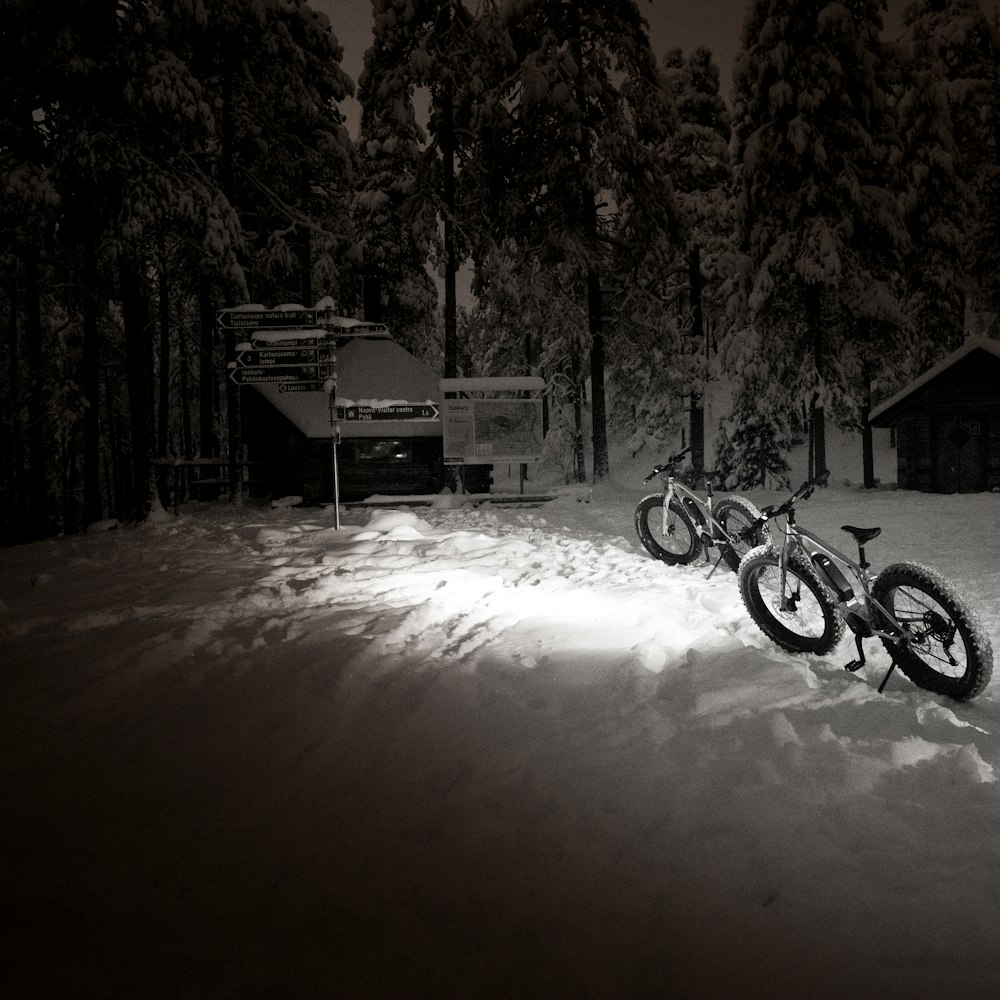 a couple of bikes that are in the snow