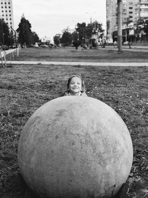 A captivating portrait of a smiling child in a park.